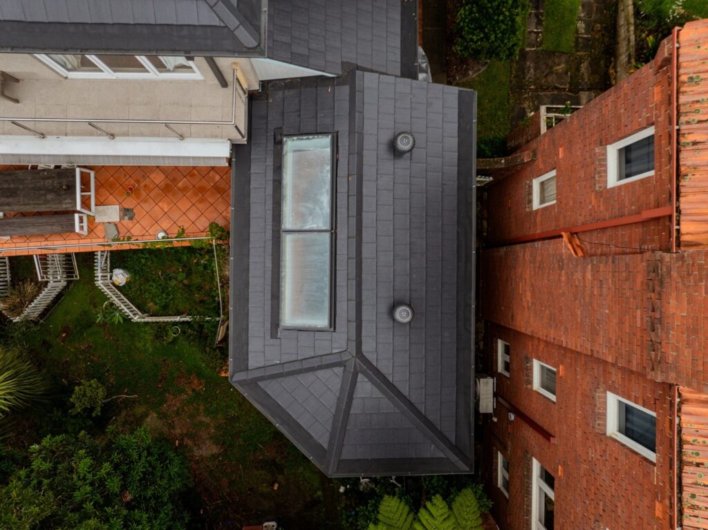 Roof restoration project in Sydney with a new tiled roof installed by the Tomkat Roofing team.