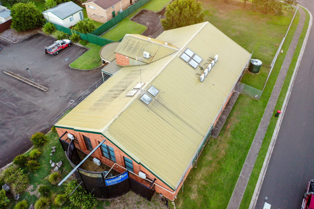Aerial photo of a residential roof inspection and roofing work by Tomkat Roofing team.