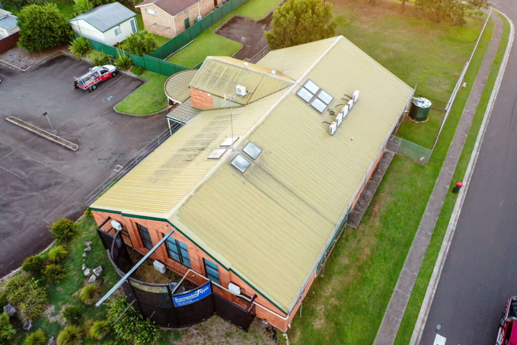 Aerial photo of a residential roof inspection and roofing work by Tomkat Roofing team.