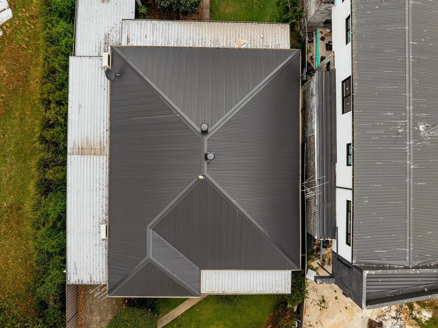 Top view of newly installed metal roof replacing old tile roofing on Sydney house