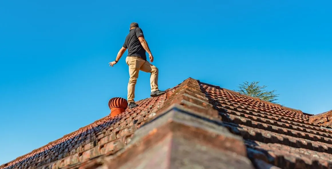 Damaged roof ridge capping and flashing requiring re-bedding repair on residential property in Sydney